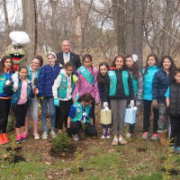 <p>Almstead arborist Michael Marks, left, with Judith Blau, second from left, creator of Treetures, Eastchester Supervisor, Anthony Colavita, middle, and local Girl Scouts at the Magic Treetures Forest Nursery in Eastchester.</p>