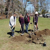 <p>Arborist Russell Wagner from Almstead, right, with board members of the Hudson Gateway Chamber of Commerce plant an American elm in Depew Park in Peekskill.</p>