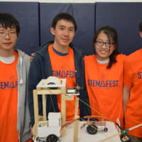 <p>From left, Horace Greeley High School students Mingjun Xiao, Eric Wang, Hanzhi Zou and Mark Wang. The students were involved in creating a simulated city that incorporates programming and engineering skills.</p>