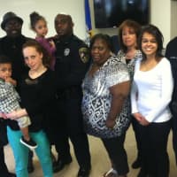 <p>Clinton Jarvis, center, who was sworn in as a New Canaan Police officer Tuesday, with his family. </p>