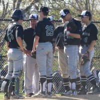 <p>Yorktown coach Sal Galinelli and the Husker infield meet on the mound. </p>