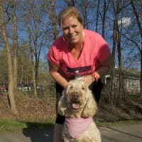 <p>Patricia Simone and her dog, Brittany, on the rail trail.</p>