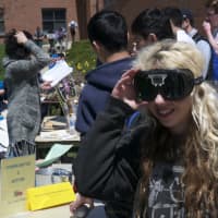 <p>A student tries on glasses that simulate being under the influence.</p>