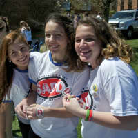 <p>Students hand out SADD bracelets and stickers.</p>