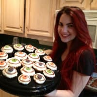 <p>Spenser White shows off her eye cupcakes. White was inspired by her grandfather to promote donor awareness.</p>