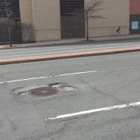 <p>Motorists speeding past The Westchester mall in White Plains usually spot this pothole too late.</p>