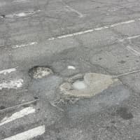 <p>A pothole on Lee Boulevard in Jefferson Valley.</p>