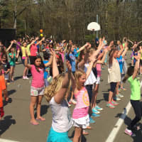 <p>Tokeneke kids sing and dance along to &quot;YMCA&quot; at the Groove-a-thon event Monday.</p>
