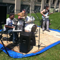 <p>The WSE band of drummer, Frank Shea, keyboardist-vocalist Yotisse Williams and bassist Peter Everett perform at the Sidewalk Art Festival.</p>