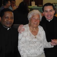 <p>Millie with Father Chris and Father George of St. Anthony of Padua.</p>