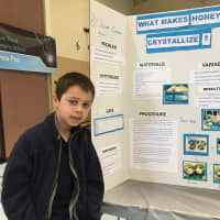 <p>Dean, a student at Meadow Pond, presented his project,&quot; What Makes Honey Crystallize?&quot;</p>