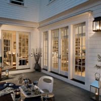 <p>Large sliding glass doors add to the appeal of many homes in the region.</p>