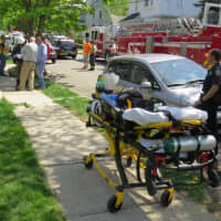 <p>There was a small crowd of neighbors watching the first responders at the scene.</p>