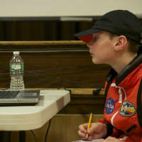<p>A technician tracks data from the mission. </p>