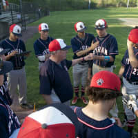 <p>The Bobcats talk it over between innings. </p>