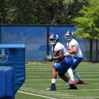<p>Sean Donnelly (far) works on drills with other offensive linemen during last week&#x27;s rookie training camp.</p>