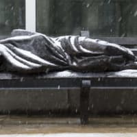 <p>The bronze sculpture depicts Jesus shrouded in a blanket on a bench. </p>