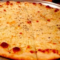 <p>Johnny&#x27;s Pizzeria is known for its thin crust pies.</p>
