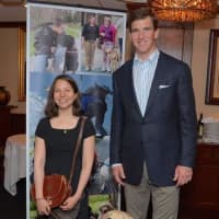 <p>Guiding Eyes graduate Emilie Gossiaux and Guiding Eyes dog London with Giants&#x27; quarterback and nine-time Golf Classic host Eli Manning. </p>
