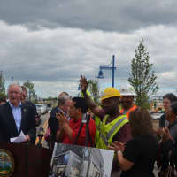 <p>Mayor Bill Finch, tradesmen and other officials make the movie theater announcement in front of the Bass Pro Shop construction site.  </p>