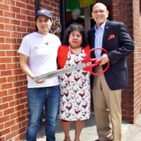 <p>Owner Luis Aguilera, left, with mom Sofia and Harrison Mayor Ron Belmont.</p>