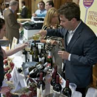 <p>A visitor gets a taste from Val&#x27;s Putnam Wines &amp; Liquors.</p>
