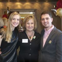 <p>Honoree Sandi Mond (middle), and Youth Group members Lilly Pura (left) and Jack Pura, who work as volunteers at the homeless shelter. </p>