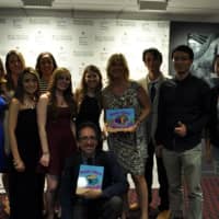 <p>Students surprised their professors with books that included photos of their experiences during the documentary and authored the books to reflect the professors names. </p>