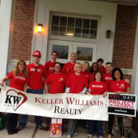<p>Employees of Keller Williams in Ridgefield celebrate the company&#x27;s Day of Red on May 14.</p>