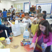 <p>Inspired by Bash the Trash performances, second-grade students made their own musical instruments using recycled materials they brought from home.</p>