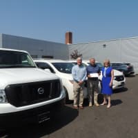 <p>Bill Casale, director of operations of STAR; Paul Miller, president of Miller Nissan in Fairfield; and Katie Banzhaf, executive director of STAR  in front of the new vans.</p>