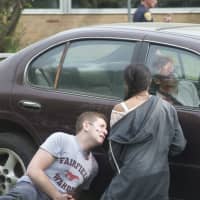 <p>Mock crash actors injured inside and outside of the car.</p>