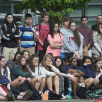 <p>Students watch the mock crash Friday morning. </p>