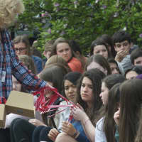 <p>Students are handed MADD bracelets.</p>