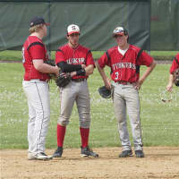<p>Somers infielders await a pitching change after Yorktown took the lead in the bottom of the sixth.</p>