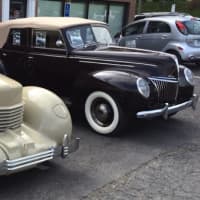 <p>A 1936 Cord, with a 1939 Ford in the background, is exhibited by Dragone Classic Motorcars, which has a showroom in Westport and a restoration facility in Bridgeport.  </p>