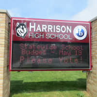 <p>No tax cap override vote is planned in neighboring Harrison, but a sign outside Harrison High School reminded residents on Saturday of the &quot;Statewide School Budget&quot; May 19.</p>