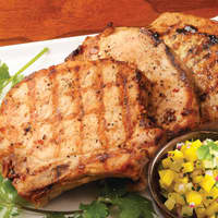 <p>Pork chops with mango salsa is a great barbecue dish.</p>