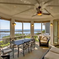<p>The five-bedroom home has waterfront views from nearly every room in the house.</p>
