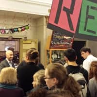 <p>Josh Tenzer, drama coach and special education teacher at Port Chester High School, greeting parents during the opening night of &quot;Rent.&quot;</p>