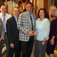 <p>Antony Stirpe, center, pictured with administrators and other staff from the New Rochelle Schools</p>