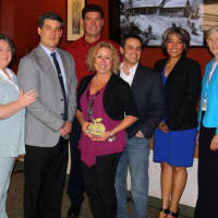 <p>Joanne Tonkin, center, surrounding by staff from the North Rockland School District</p>