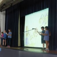 <p>Katonah Elementary School fifth-graders read the book Michael Recycle to their classmates as they reflected on Earth Day.</p>