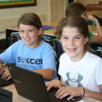 <p>Bronxville students Ava Black and Mae Thomas working with Chromebooks and Google Apps for Education.</p>