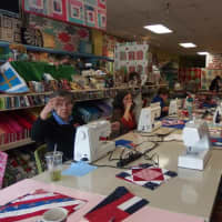 <p>Women work on making the quilts for veterans at Christie&#x27;s Quilt Shop on Main Avenue in Norwalk.</p>