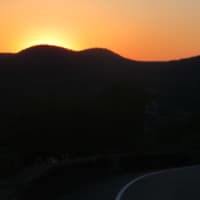 <p>The sun goes down over Bear Mountain on Friday.</p>