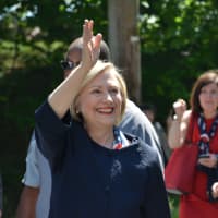 <p>Hillary Clinton waves as she marches in New Castle&#x27;s Memorial Day parade in downtown Chappaqua.</p>