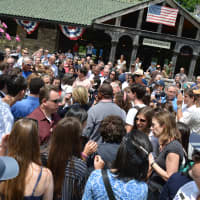 <p>A packed crowd circles around Hillary Clinton after the Memorial Day parade in Chappaqua.</p>