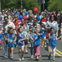 <p>The Weston Girl Scouts walk in Monday&#x27;s parade.</p>