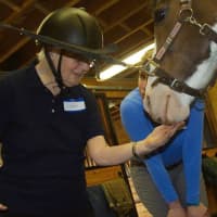 <p>Hannah Wirfel, a PATH Therapeutic Riding Instructor, works with Janet, a resident of Waveny LifeCare Network in New Canaan.</p>